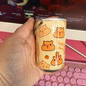 Capybara face and hand wipes in a can keychain